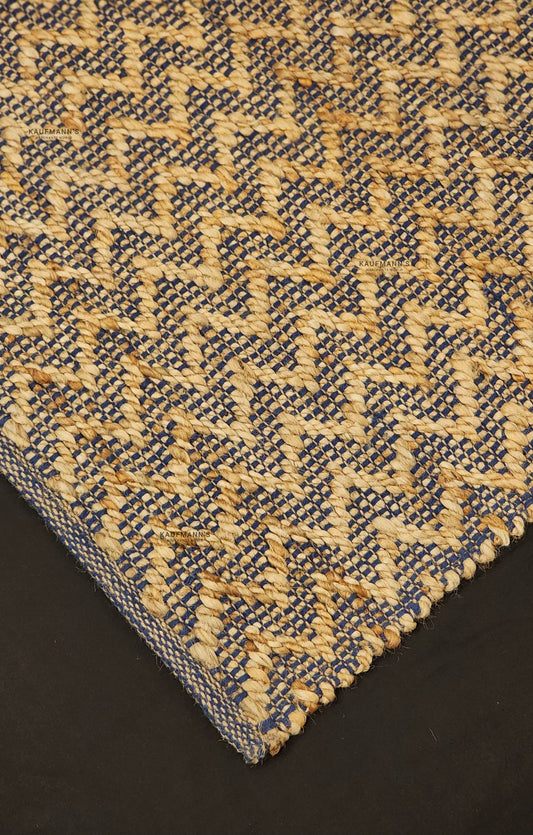 A jute rug with a geometric pattern beige colors, showcasing a textured design. featuring a combination of blue and 