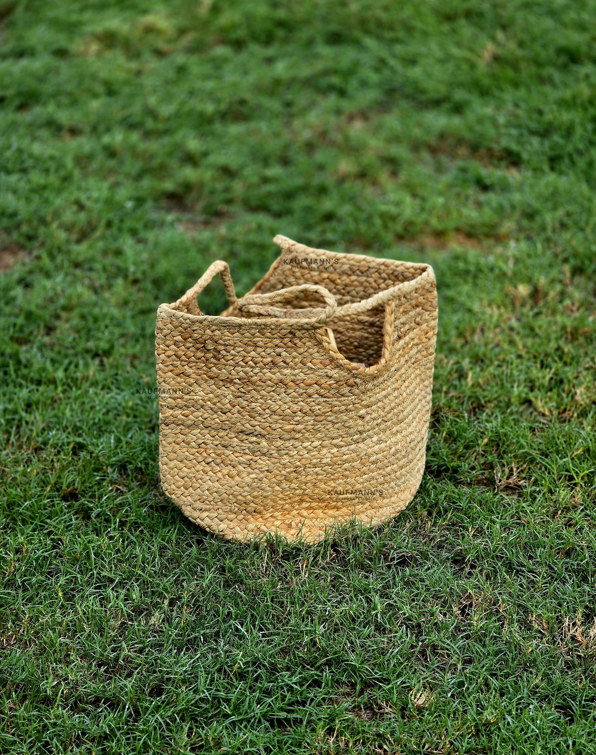 A beige handcrafted coir bag placed on grass.